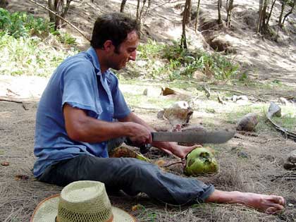 Maarten cutting a coconut